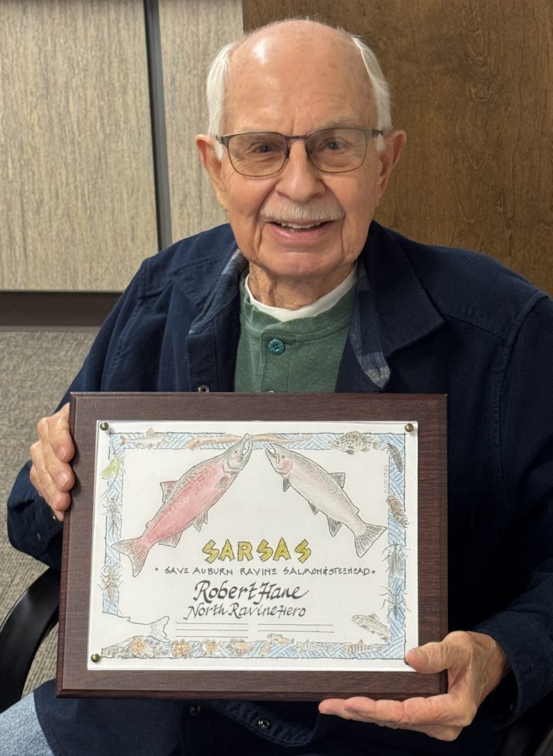 Robert Hane holding a SARSAS North Ravine Hero plaque