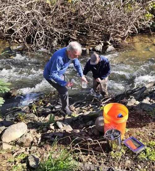 Volunteers collecting a water sample